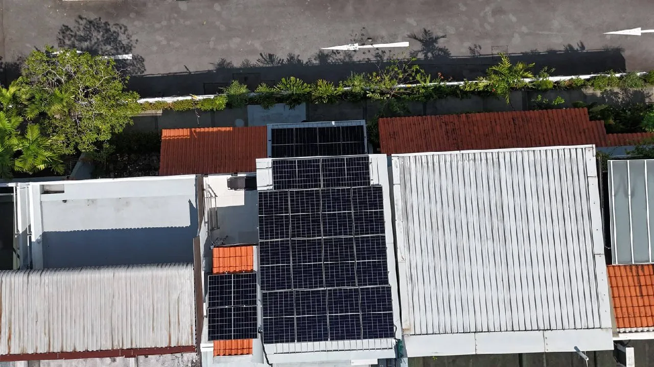 Solar panels installed on a terracotta tile roof of a Singapore landed property